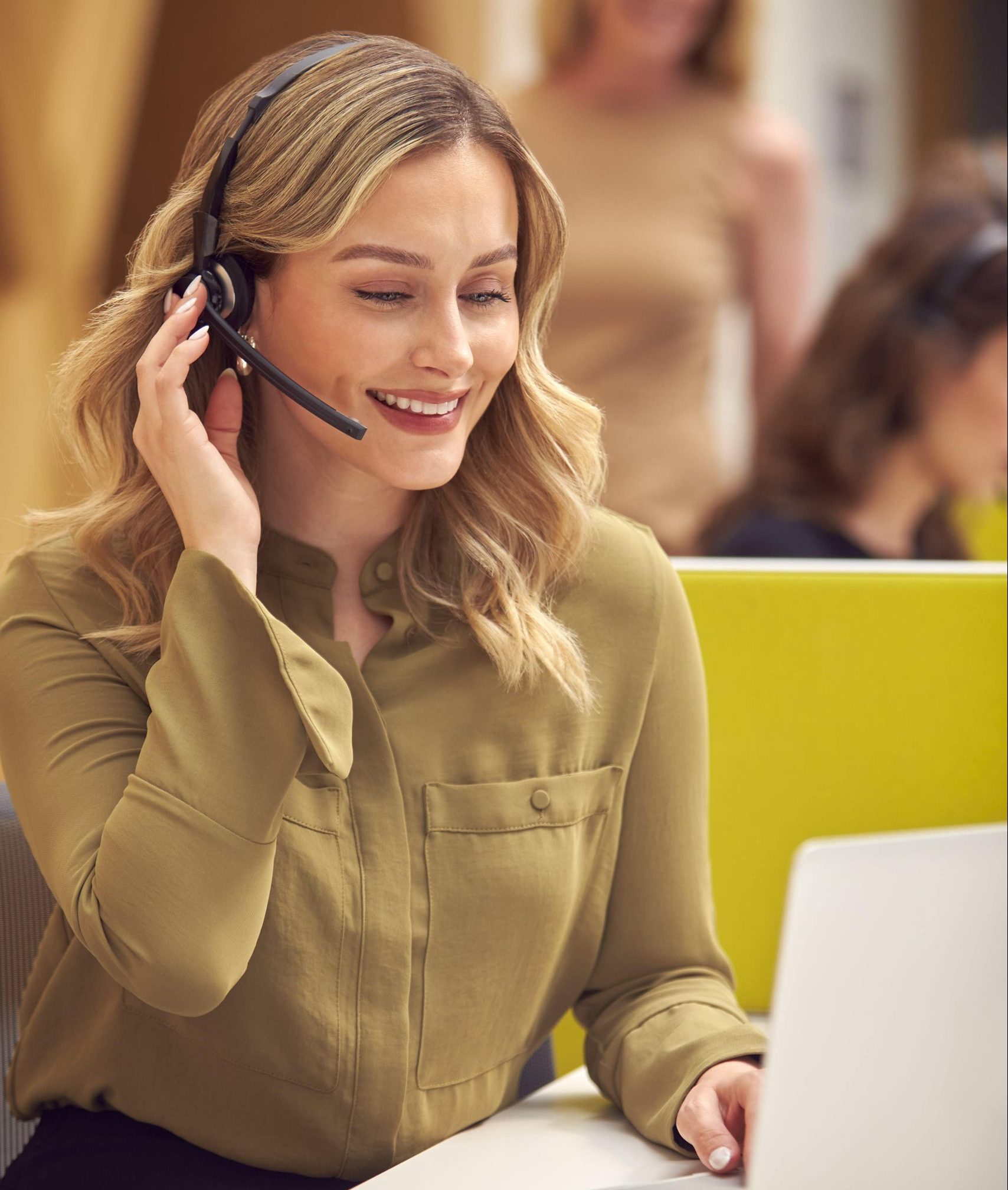 businesswoman in cubicle wearing headset talking t 2021 12 09 06 51 29 utc min min min scaled e1685706864220